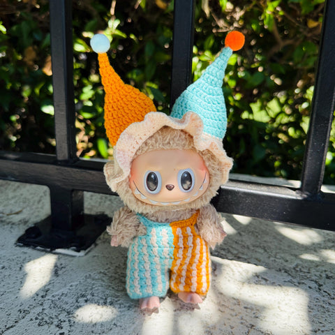 Labubu dressed in a handmade crochet clown outfit